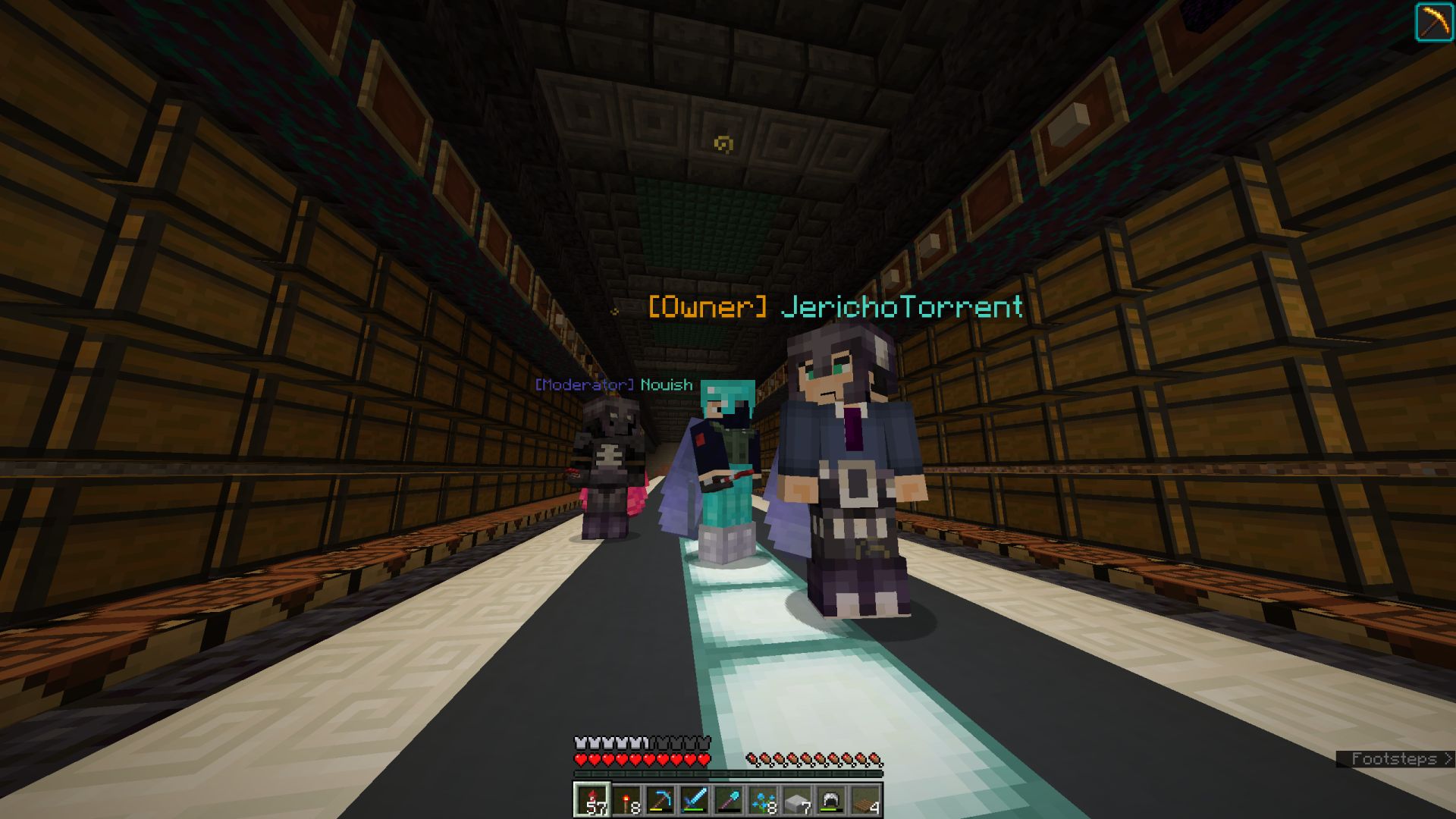 A few members of the team within the main storage of the stronghold megabase.